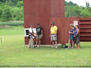 Group of shooting sports enthusiasts conversing